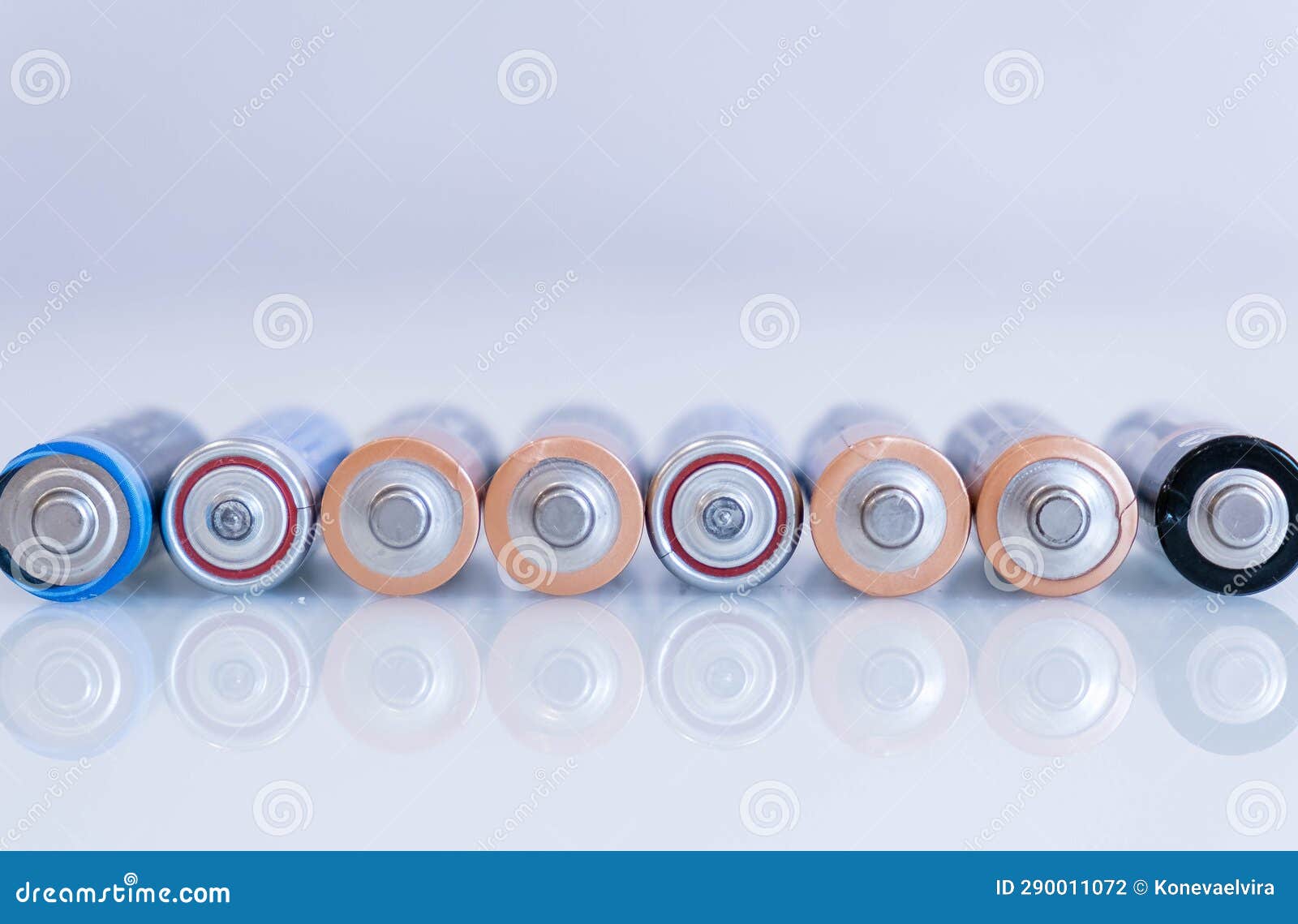 old battery was leaking, hazardous waste. abstract background of colorful batteries. . alkaline battery aa size. group