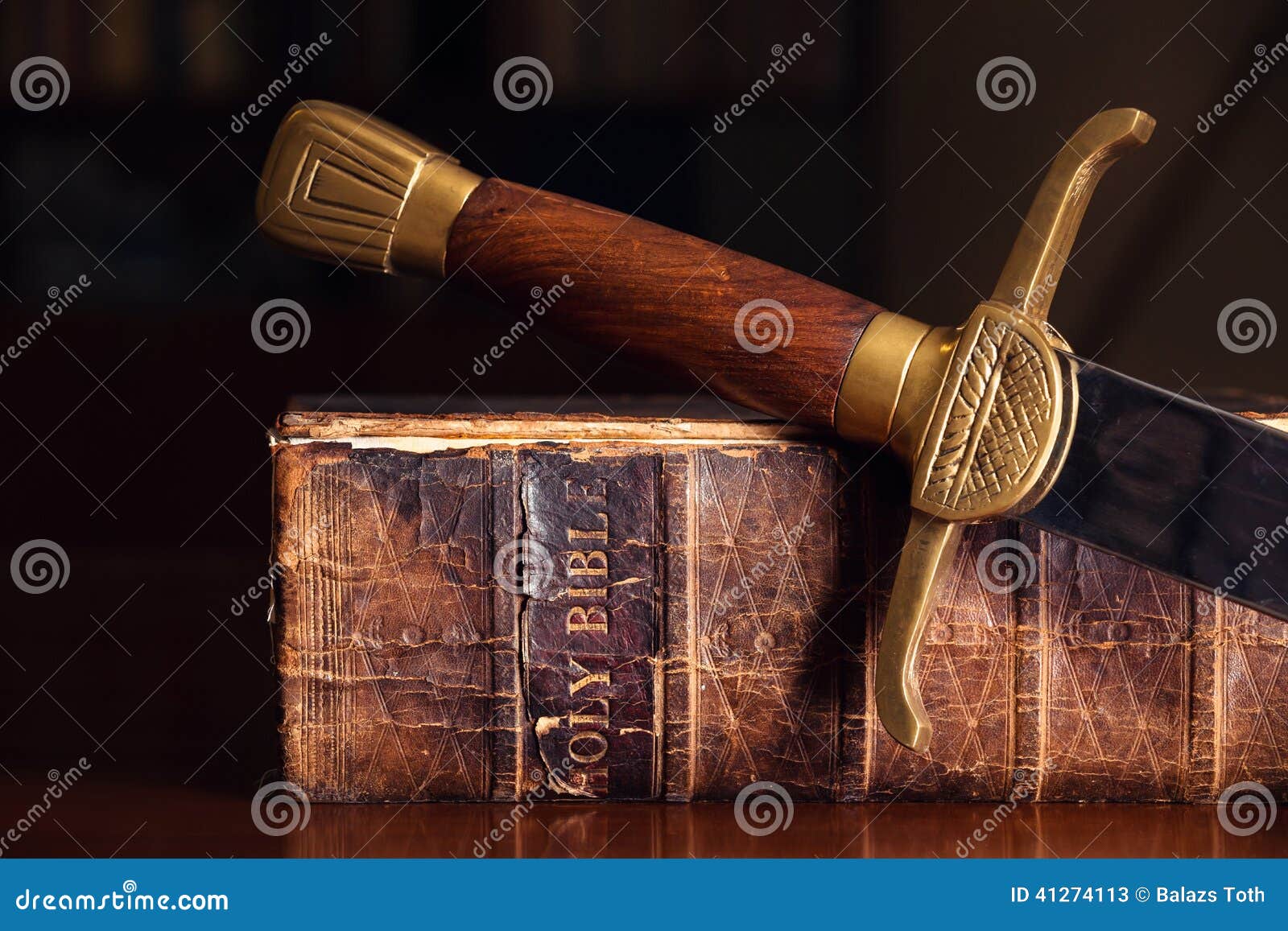 old bible with sword