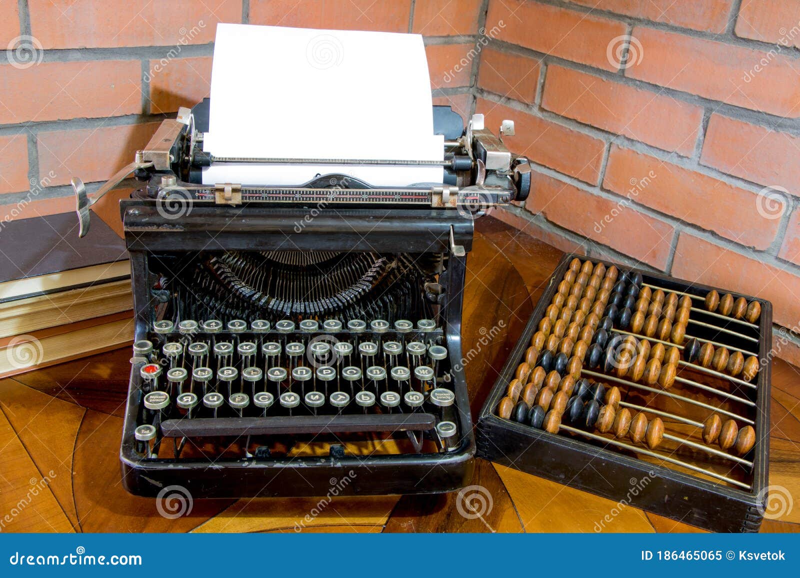 Old black typewriter with paper