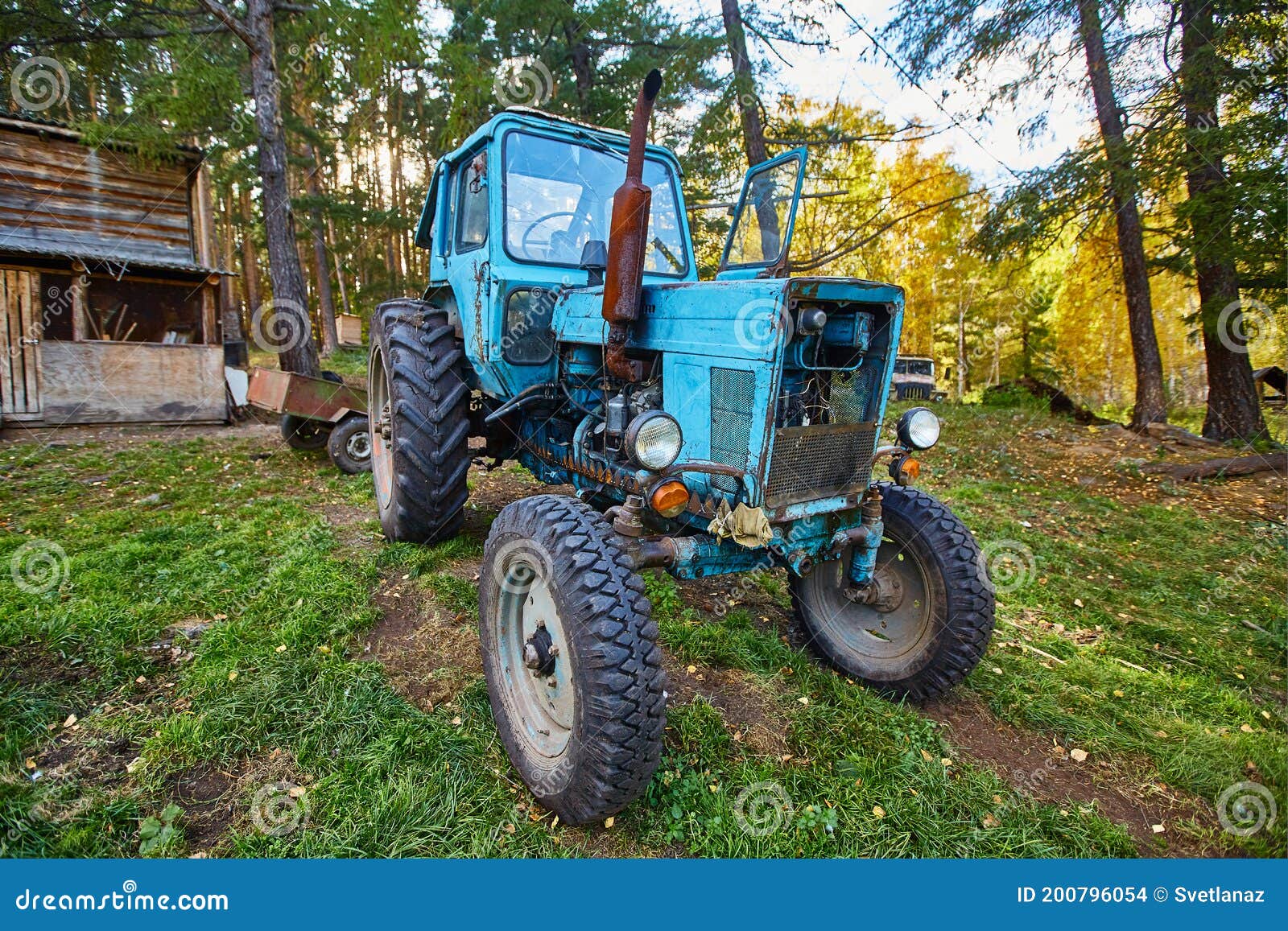 An Old Blue Tractor Stands in a Farmyard Stock Photo Image of
