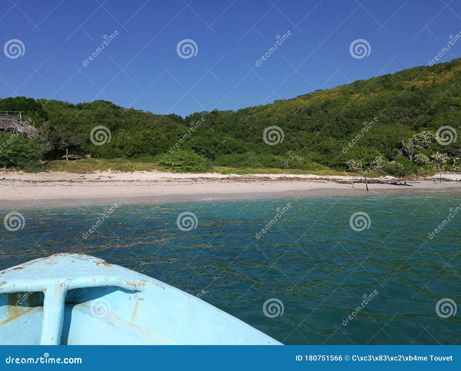 old boat berthing the idyllic beach of the cocinas island