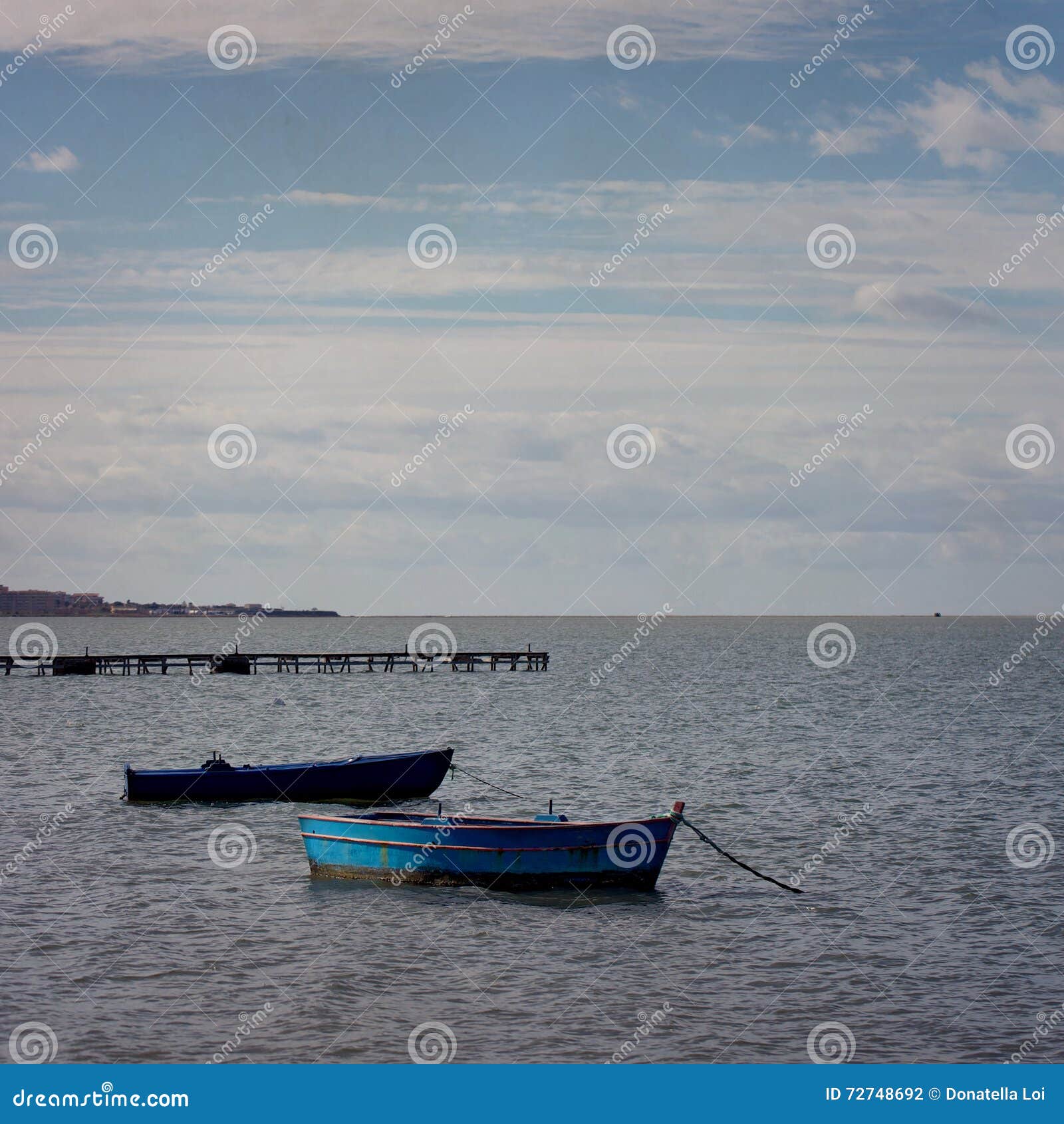 Old boats in choppy waters stock photo. Image of square 72748692