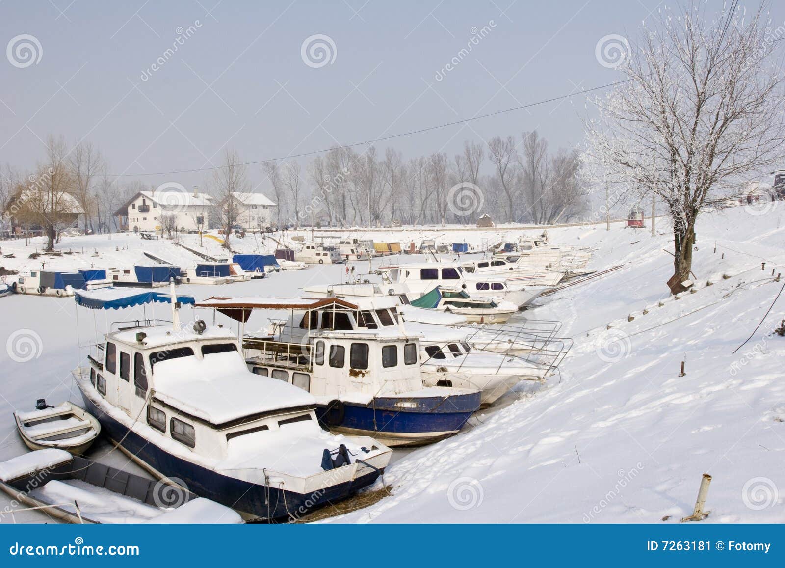 old boats in frozen marina