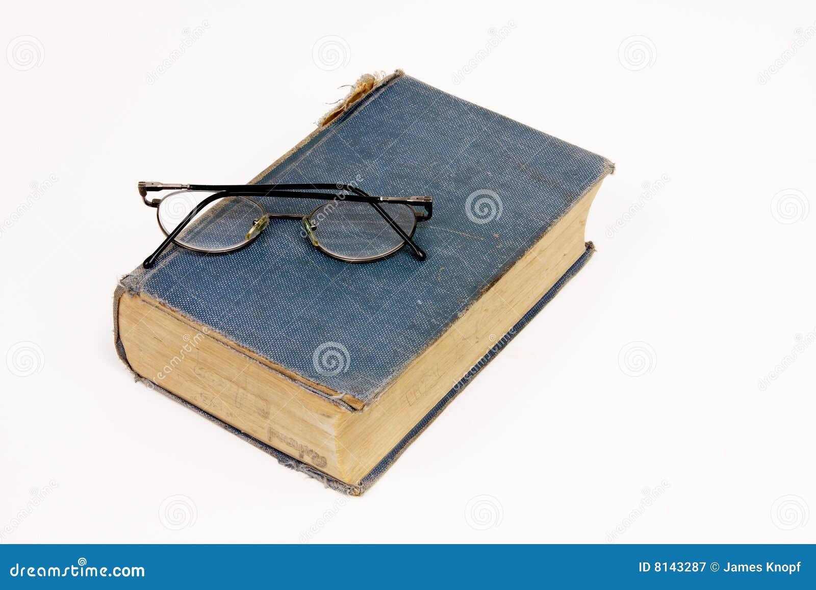 Old Book with Reading Glasses Resting on White Stock Image Image of