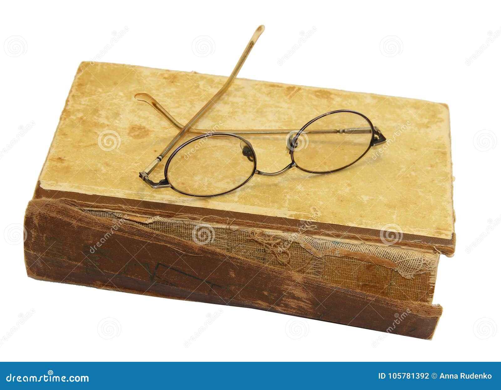 On an Old Book with a Torn Binding and a Broken Spine are Glasses Stock