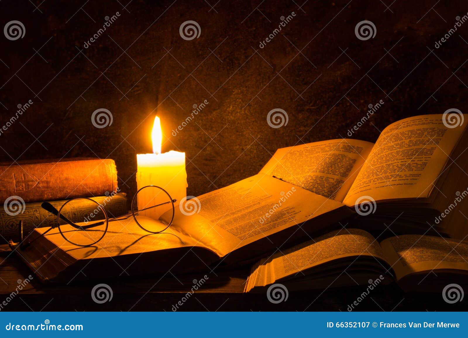 old open book with candle