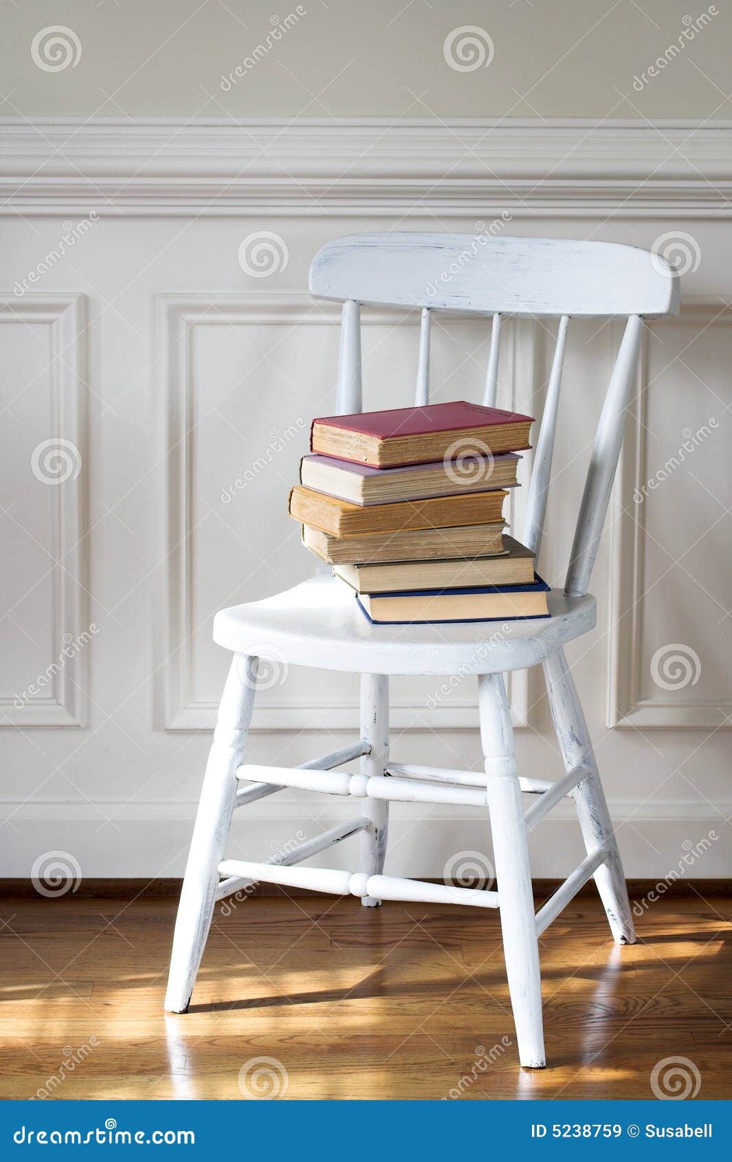 Old books on chair stock image. Image of volume, fashioned 5238759
