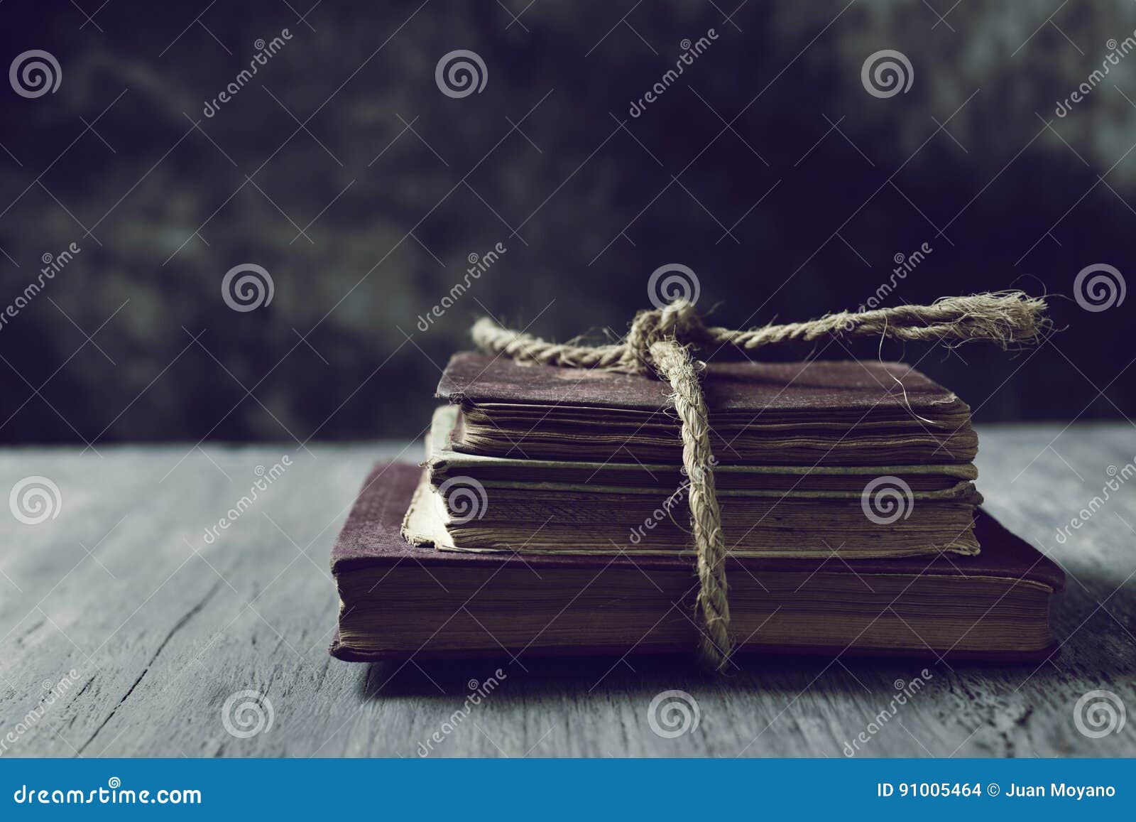 old books tied with a string