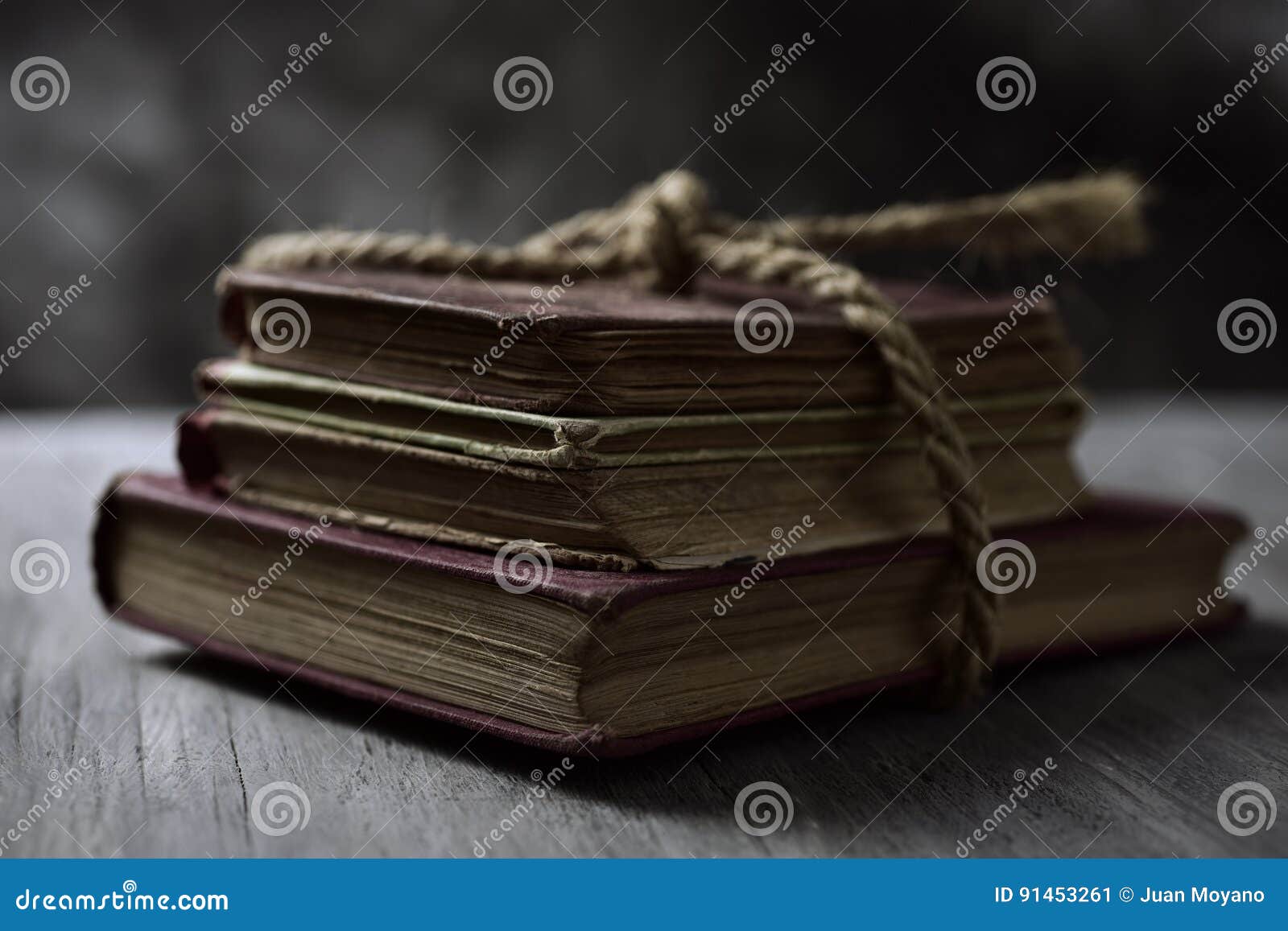 old books tied with a string