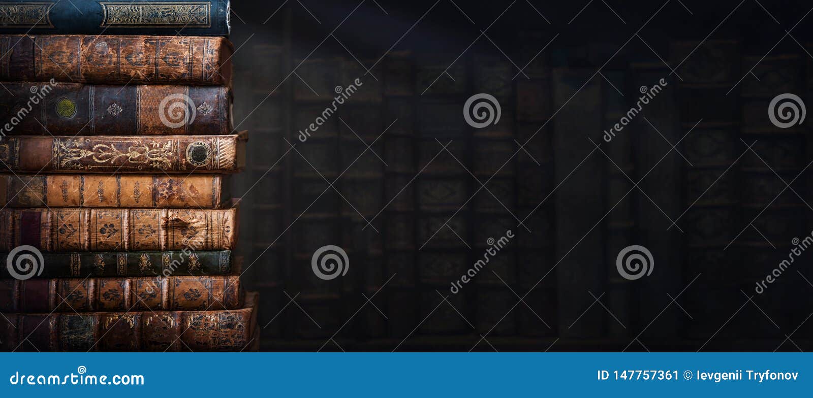 old books on wooden shelf and ray of light. bookshelf history theme grunge background. concept on the theme of history, nostalgia