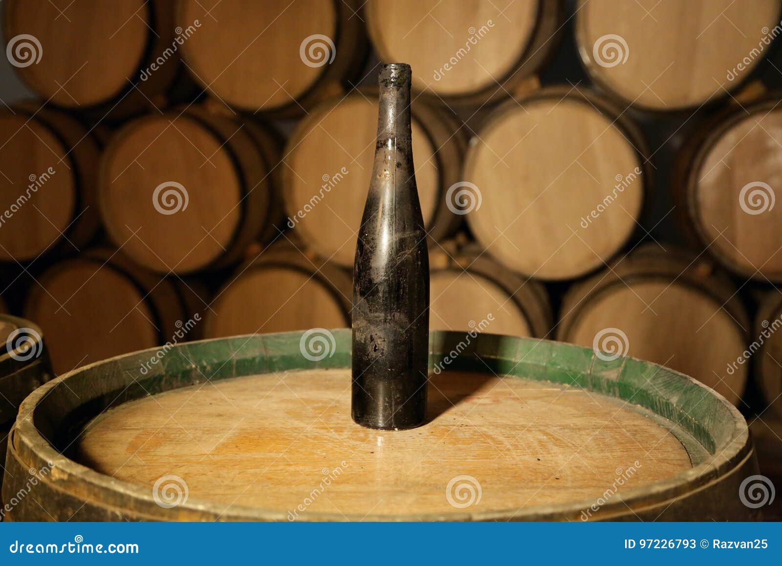 Old Bottle of Wine on a Barrel in Winery Cellar Stock Image Image of
