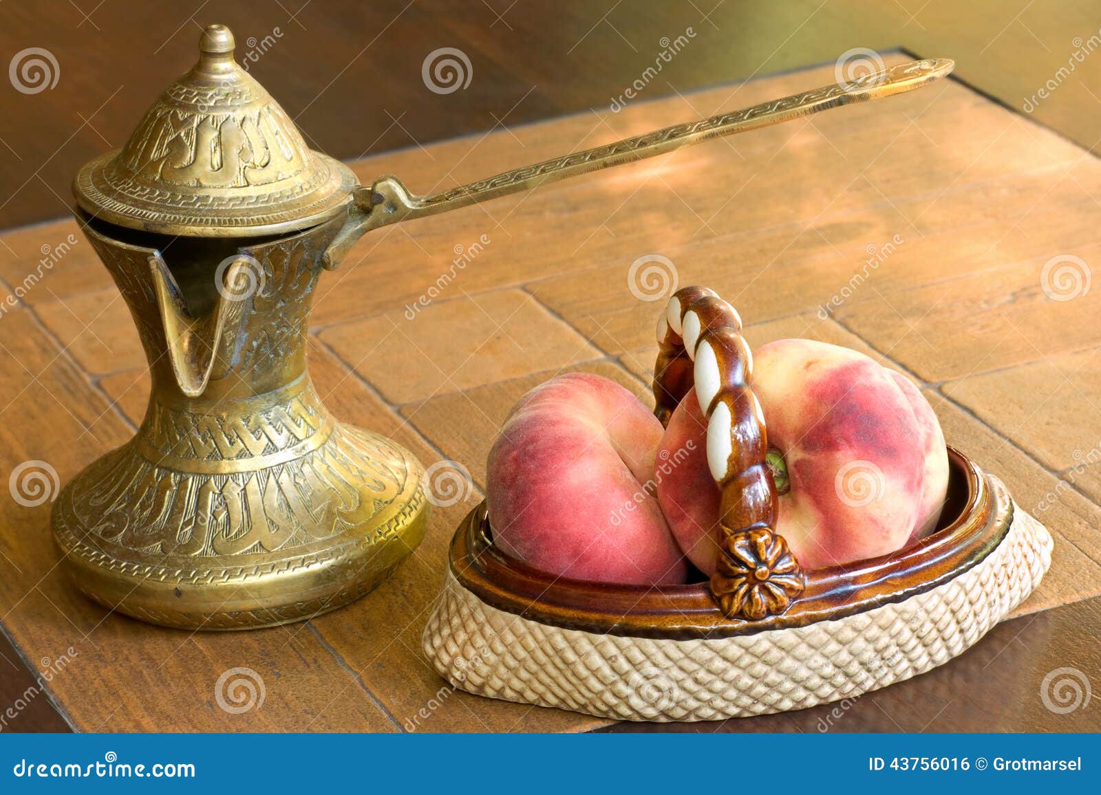 Old Brass Arabian Style Coffee Pot and Ceramic Vase with Peaches Stock