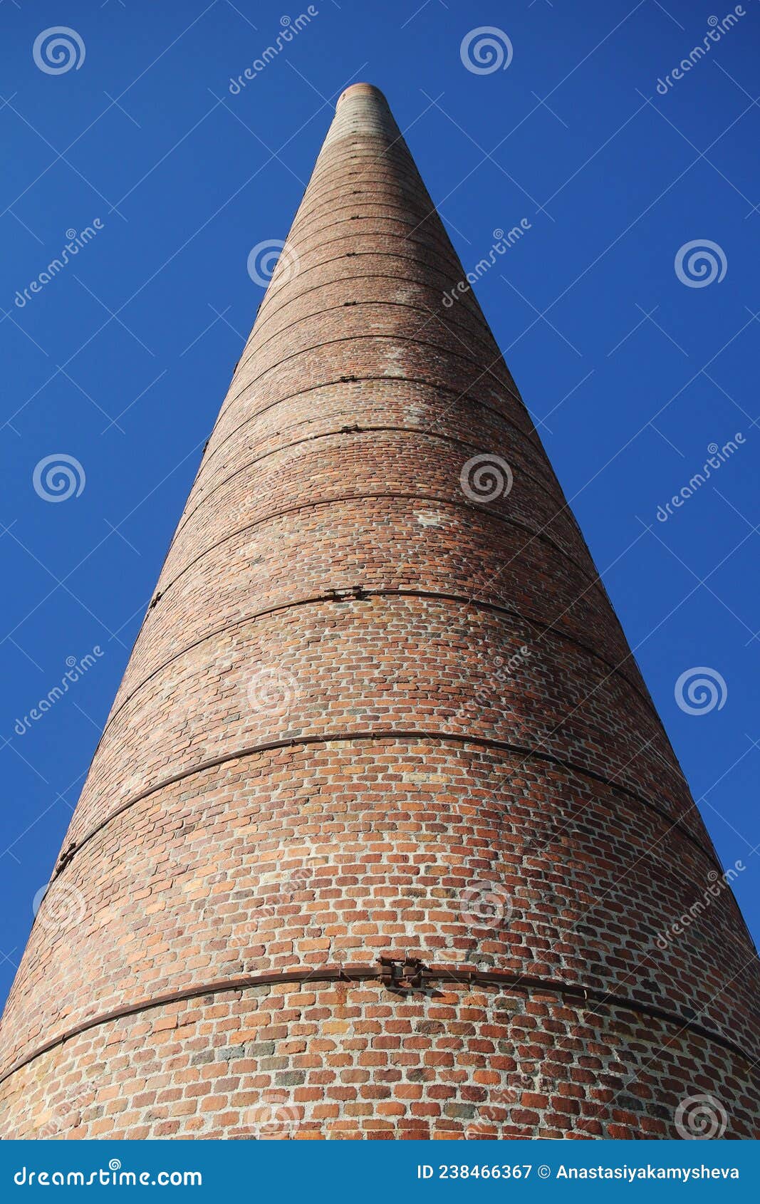 an old brick chimney at the beach in malaga, spain