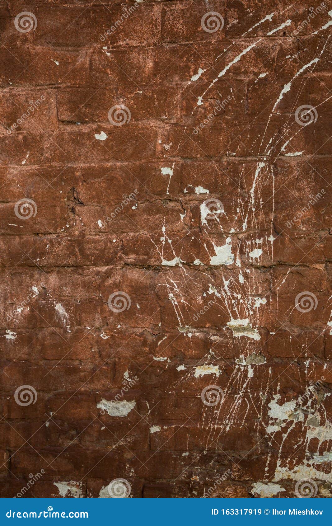Old Brick Wall of Red Color with Scratches and White Spots. Stock Image