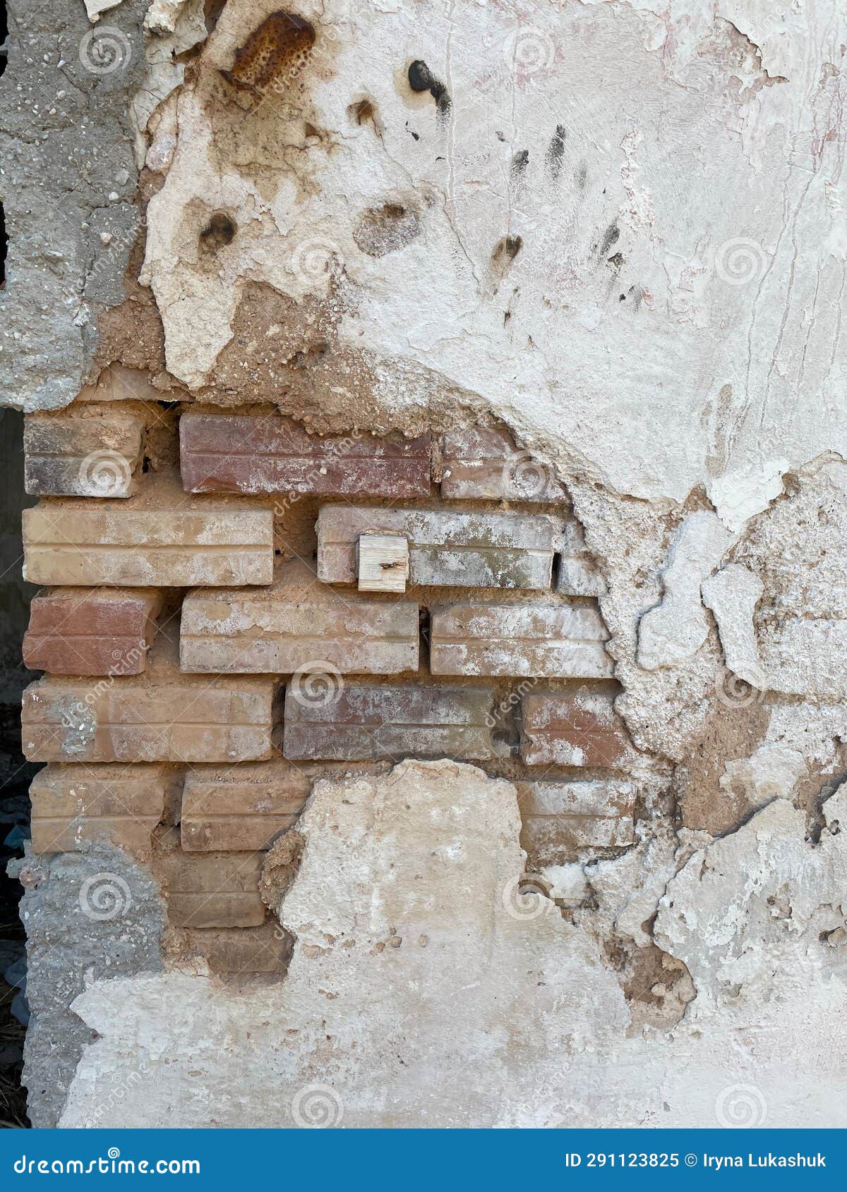 Old Brick Wall with Rough Crumbled Plaster Layers, Closeup. Stock Image
