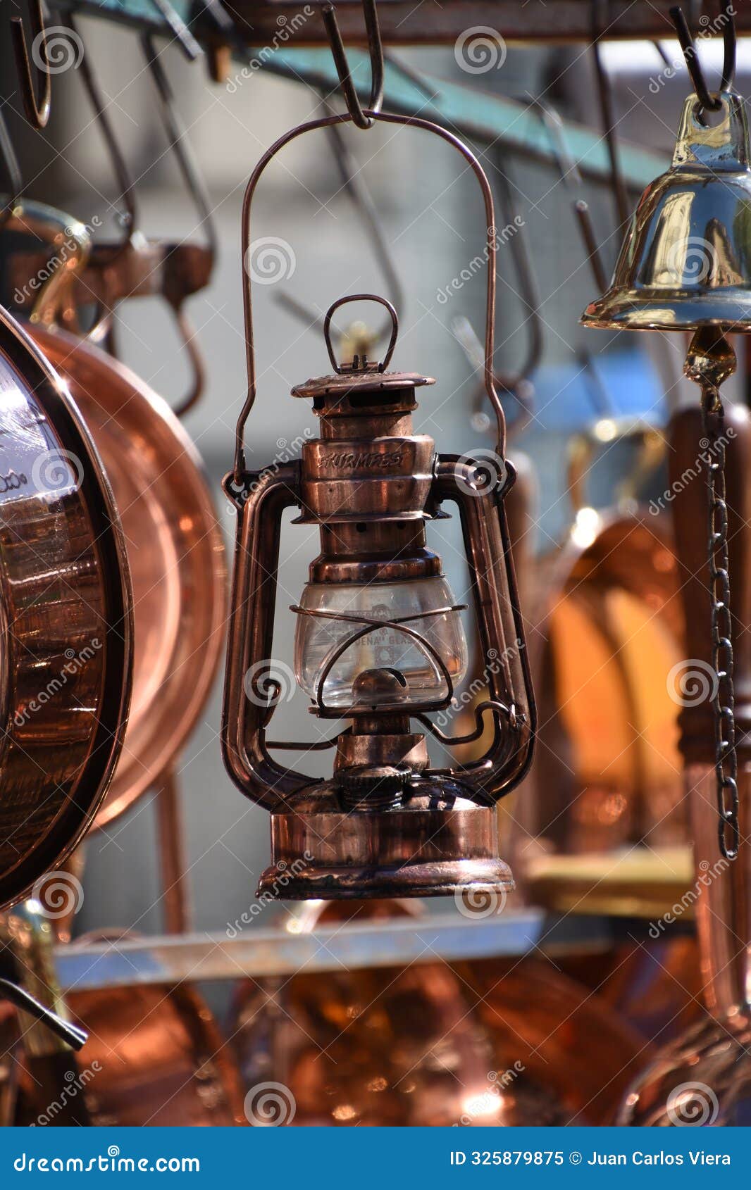 old bronze kerosene lamp at a colonial fair
