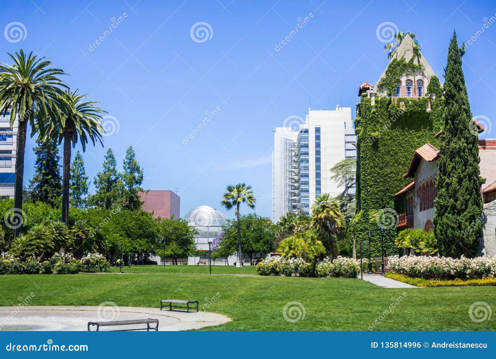 old building at the san jose state university; the modern city hall building in the background; san jose, california