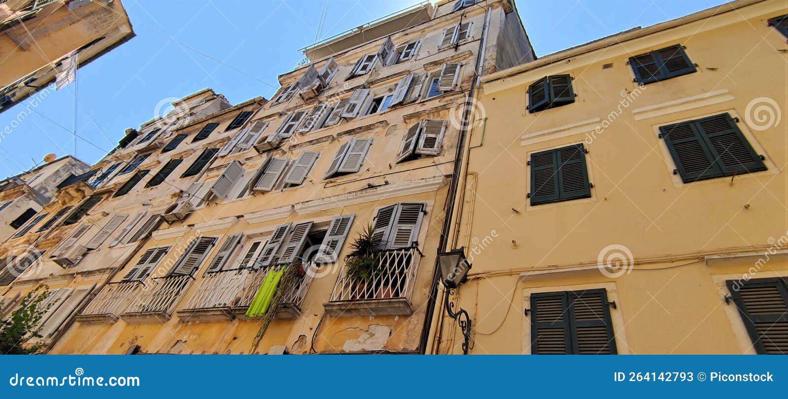 old building with shuttered windows on kapodistriou street in corfu - facade view