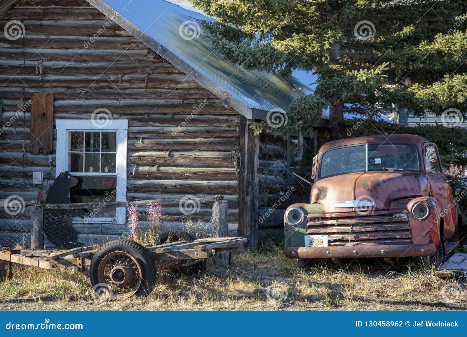 Old Car and Cabin in Carcross, Yukon Canada. Editorial Photography