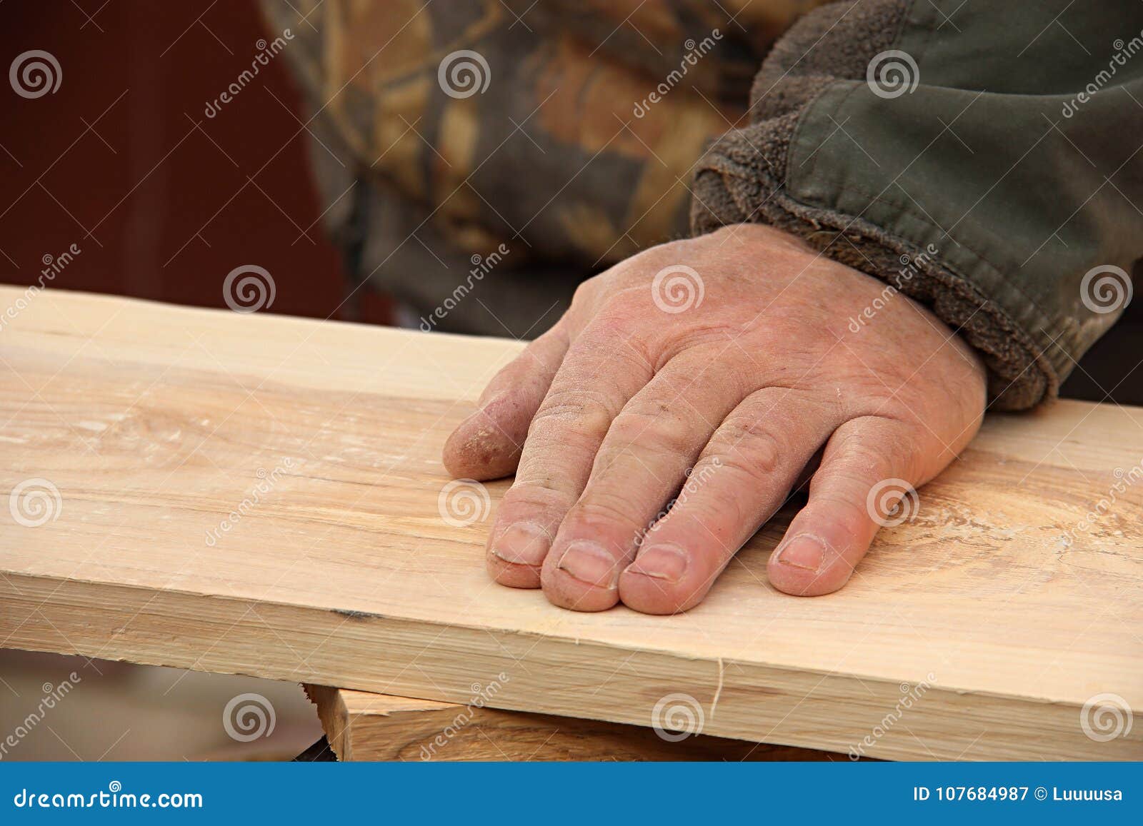 The Old Carpenter Checks The Quality Of The Sanding Of The Wood A