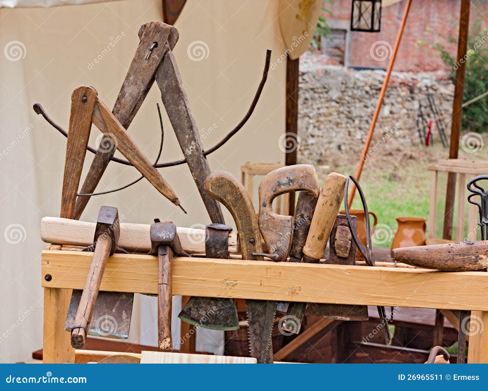 Woodworking hand tools of antique carpentry - old bench with carpenter 