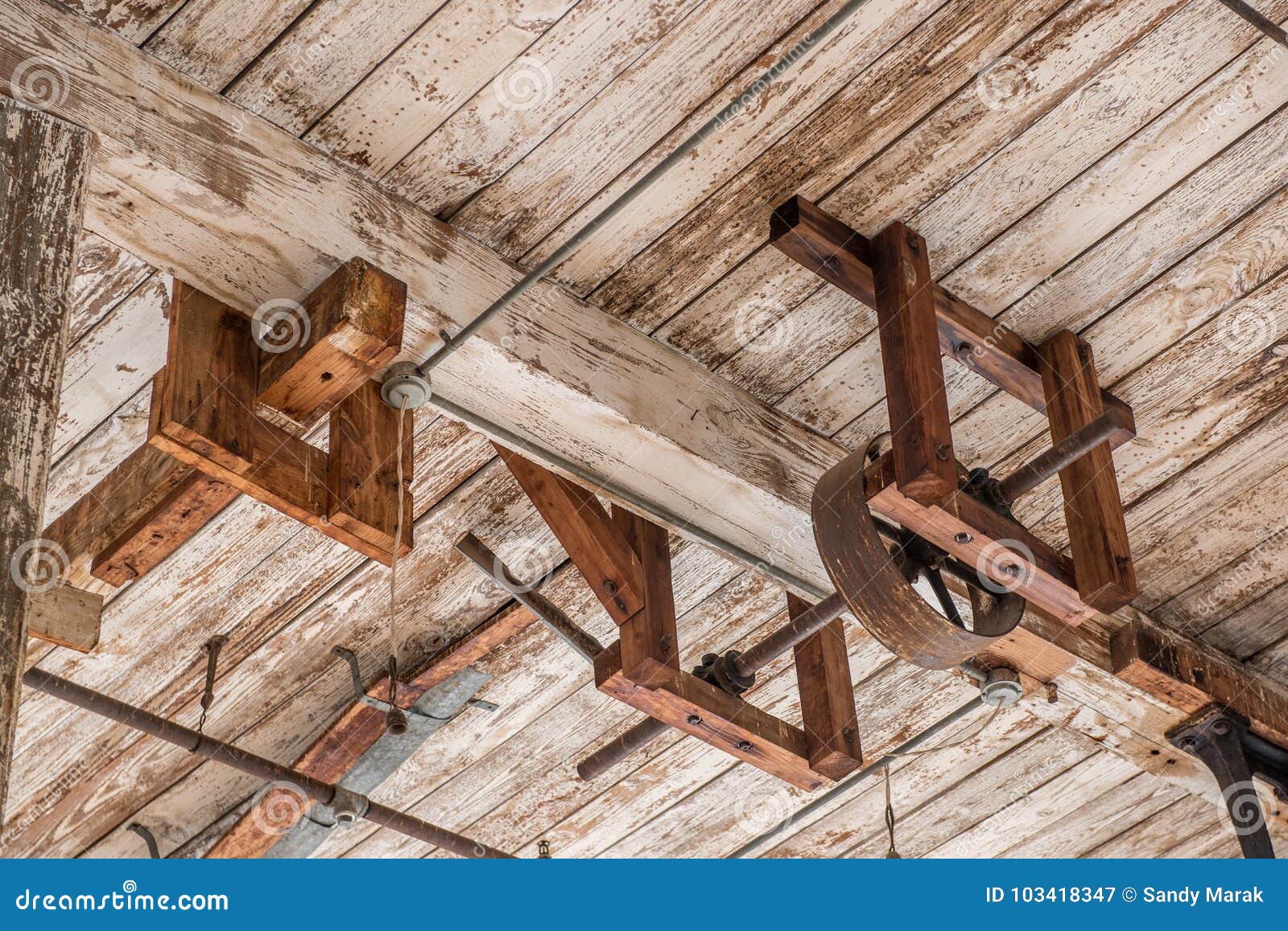 Old Ceiling With Wheel And Beam With Peeling Paint Stock
