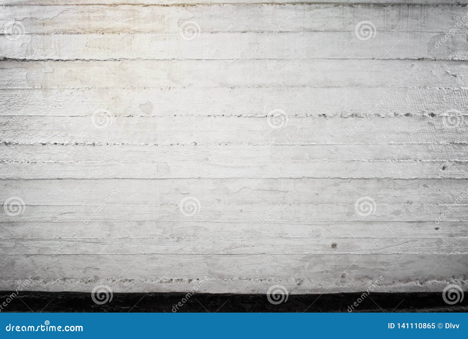 old concrete wall with visible layers, painted white and black