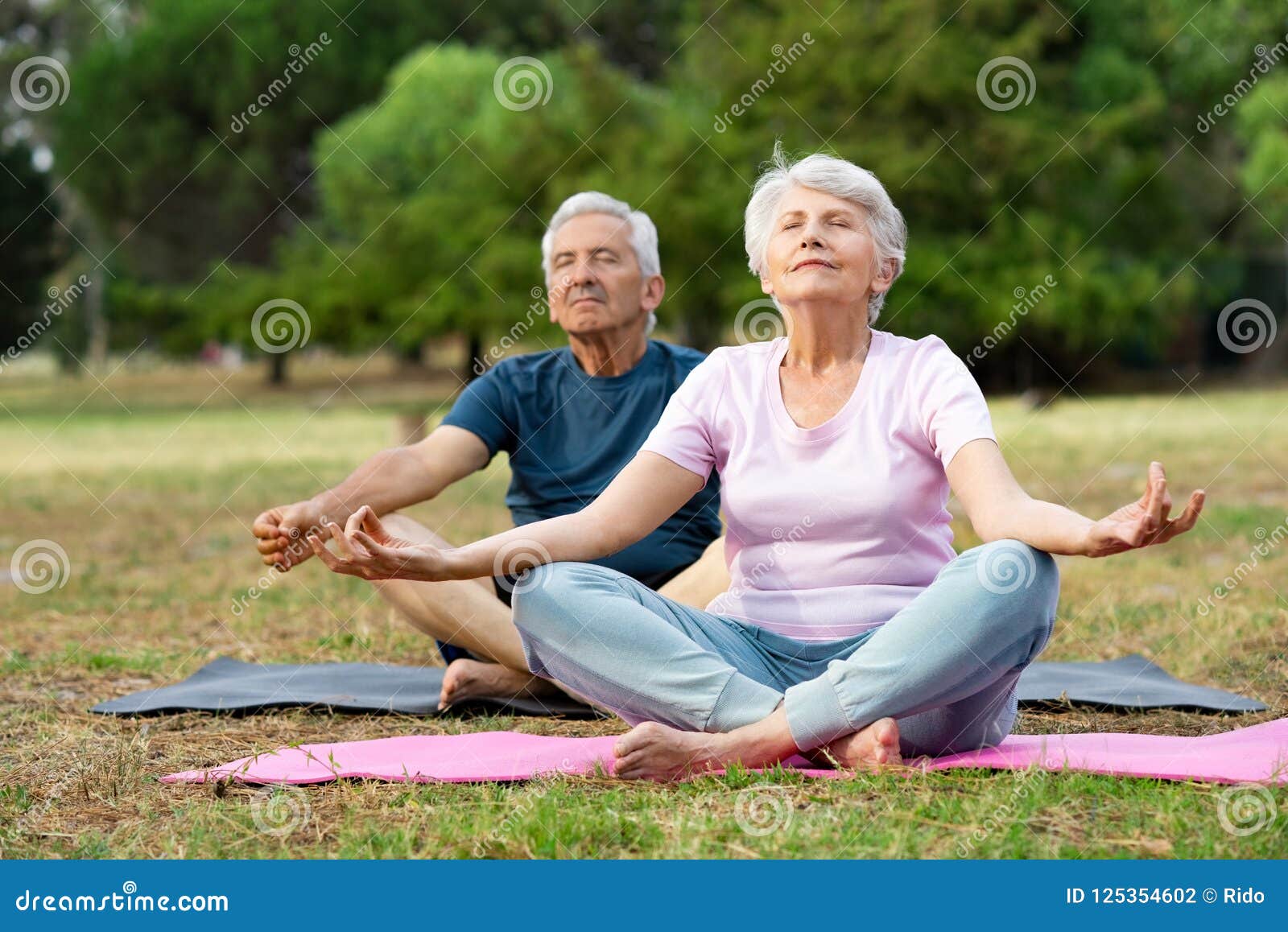 senior couple doing yoga