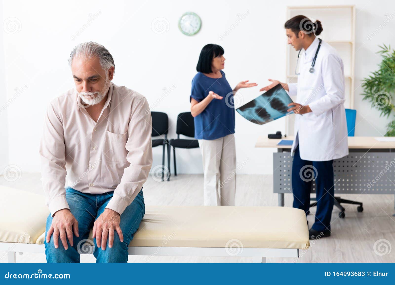 Doctor and elderly couple stock image. Image of couple 