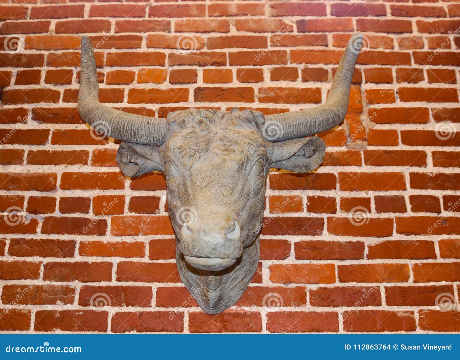 Old Cows Head Replica Hanging on a Rough Brick Wall Stock Photo Image of cattle, finance