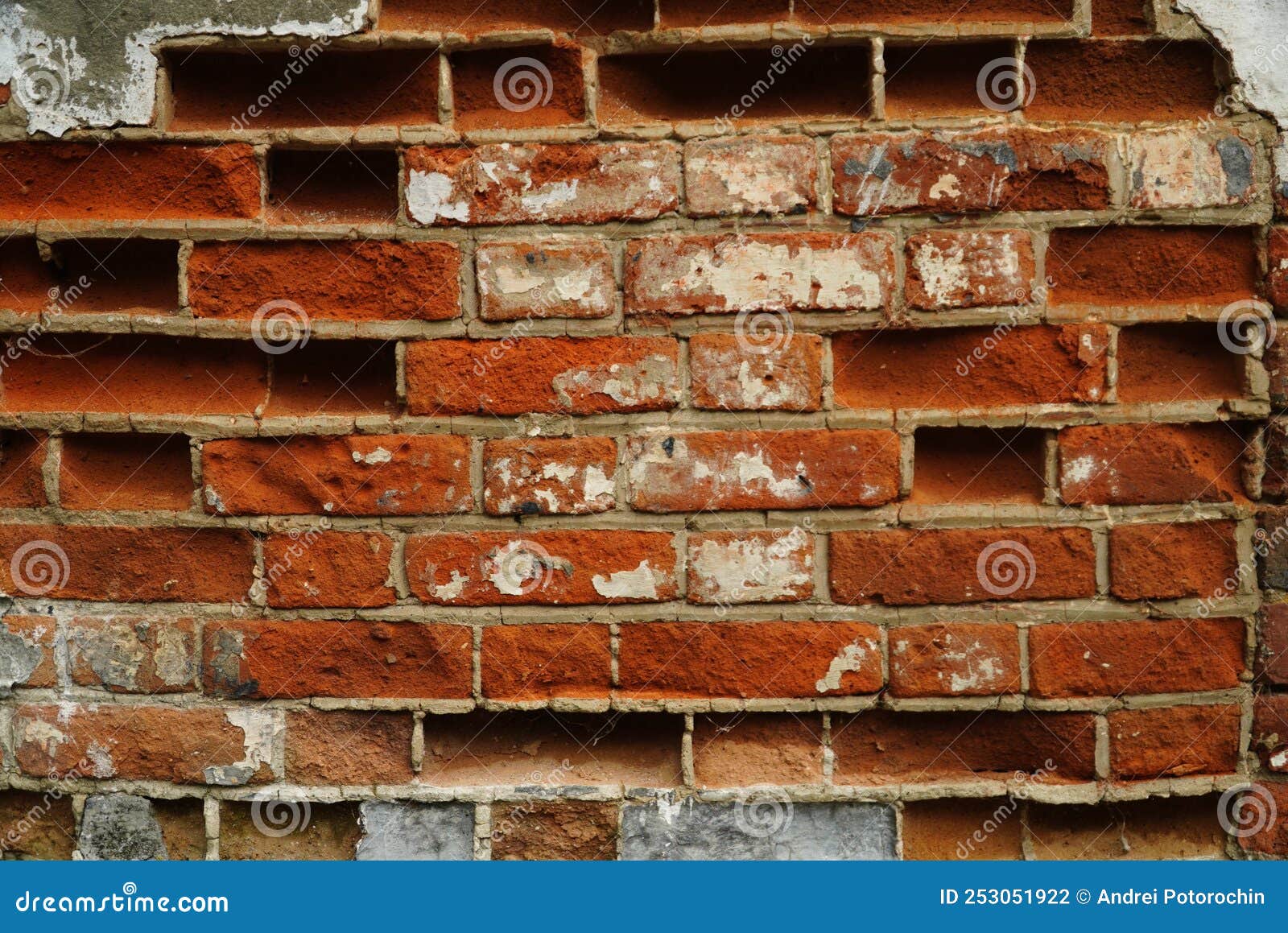 An Old Crumbling Wall with Destroyed Bricks between a Strong Masonry ...