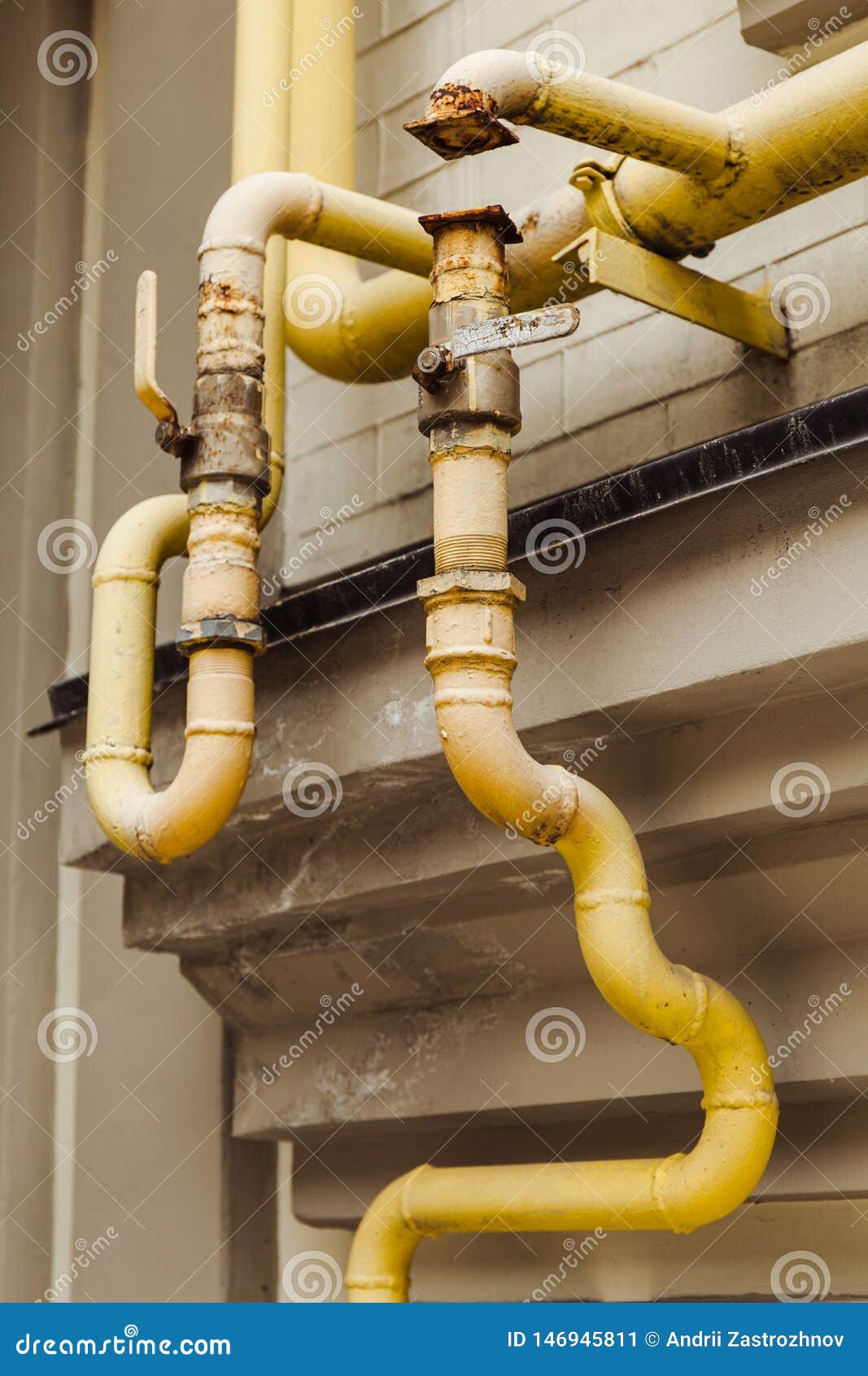 Old Curved Yellow Pipes on the Old House. Stock Image Image of