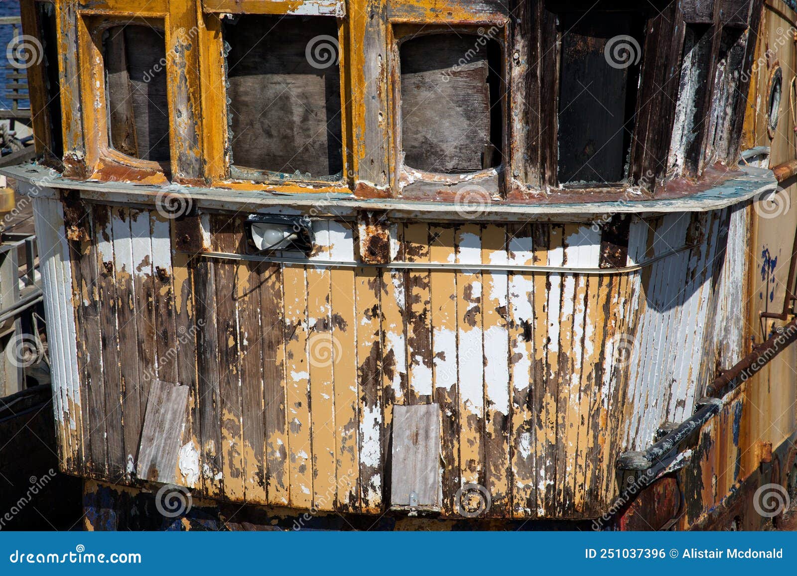 closeup view of old decaying fishing boat at a harbour location