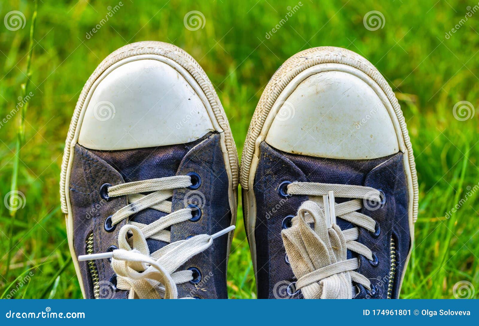 Old, Dirty, Shabby Sneakers on the Green Grass. Hiking Travel Concept ...