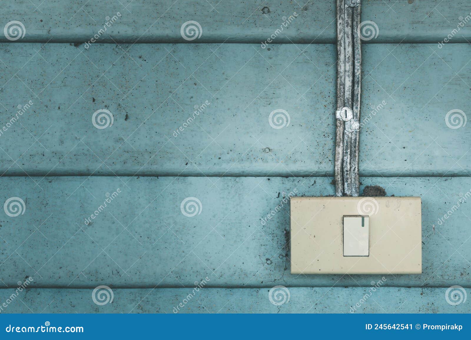 Old Electrical Light Switch with Old Vintage Blue Wooden Wall Stock