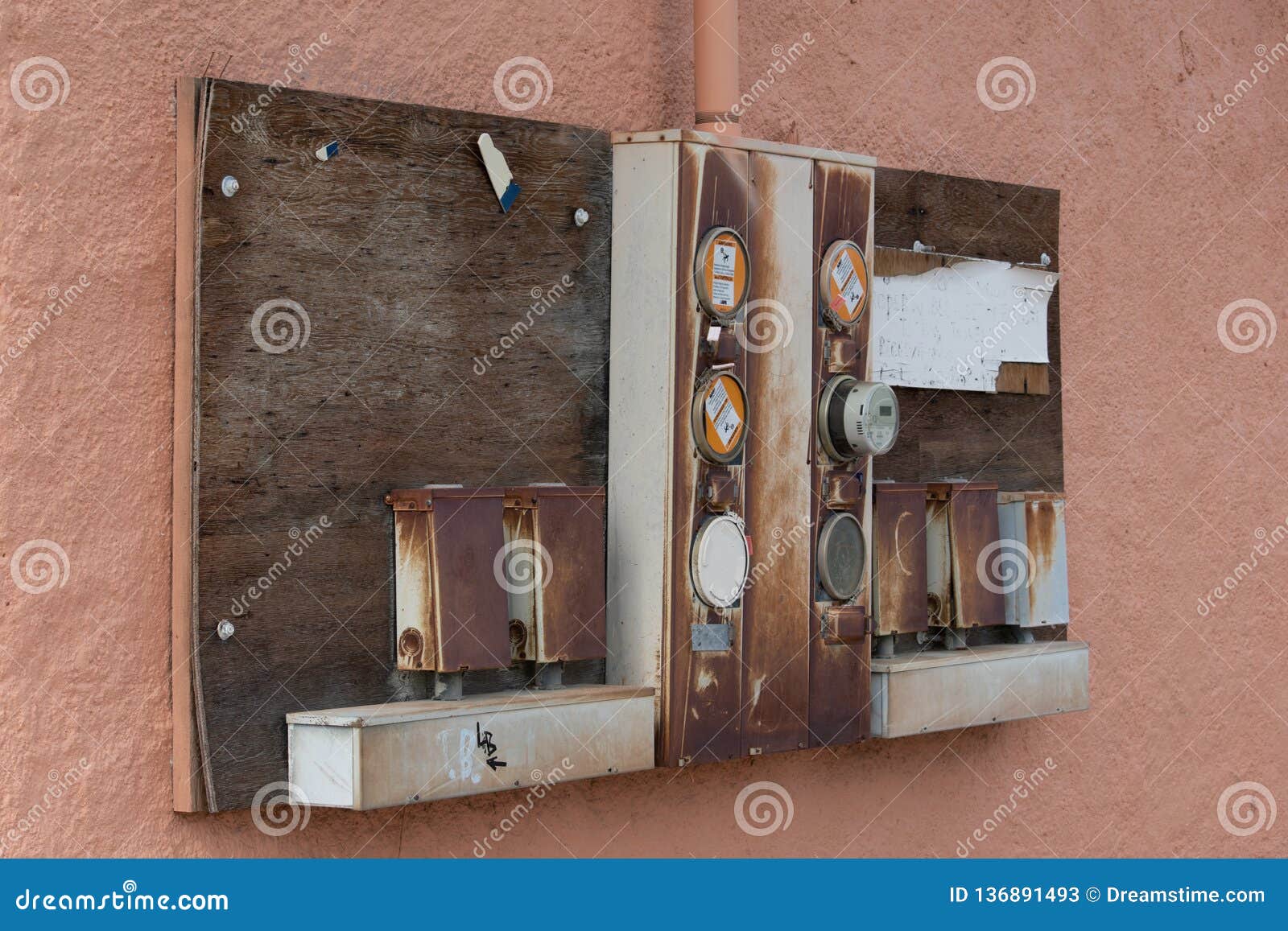 Old Electrical Panel Mounted on a Stucco Wall of an Old Building Stock