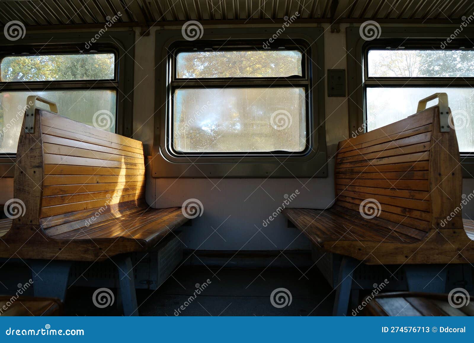 old empty wagon of train. wooden seats in an empty coach of train