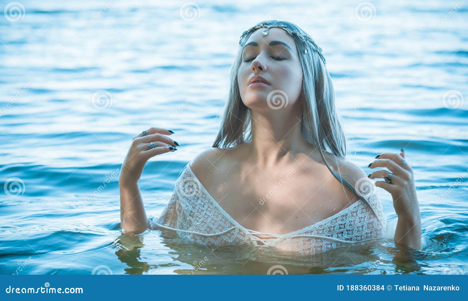 pagan rituals in lake, young woman in white