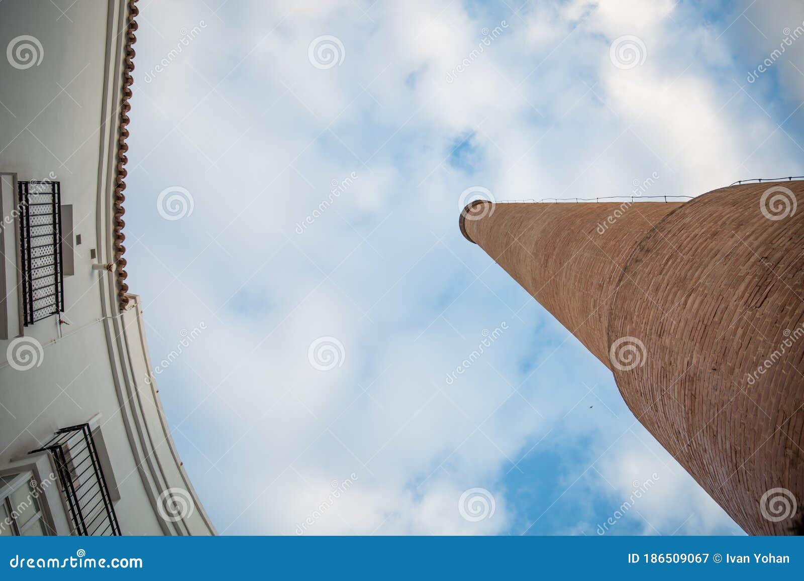 old factory chimney made of orange bricks in jerez de la frontera, south of spain