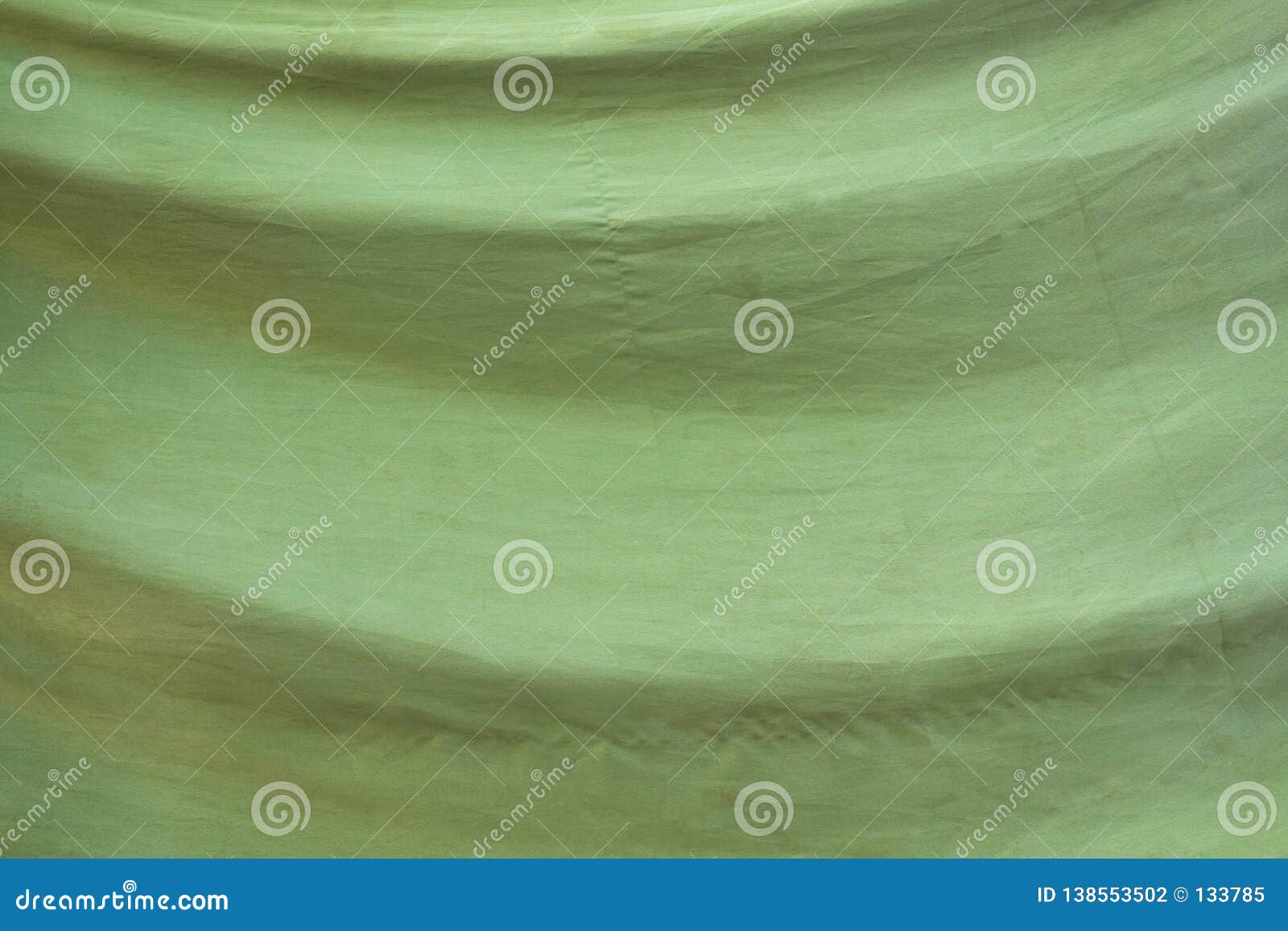 Old Faded Green Fabric with Folds. Rough Surface Texture Stock Photo