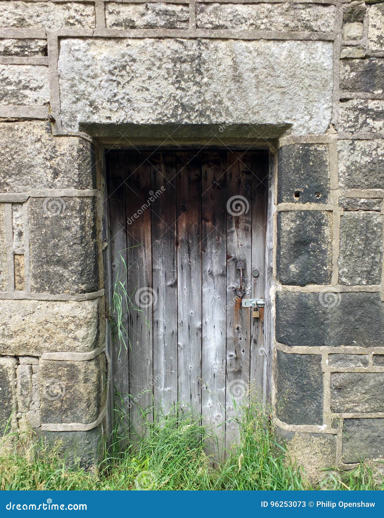 Old Faded Plank Bare Wooden Door in a Stone Building Stock Image ...