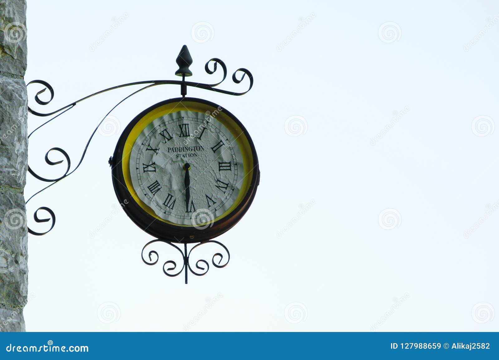 Old Fashioned Wall Clock with `Paddington Station` Text Inside Stock
