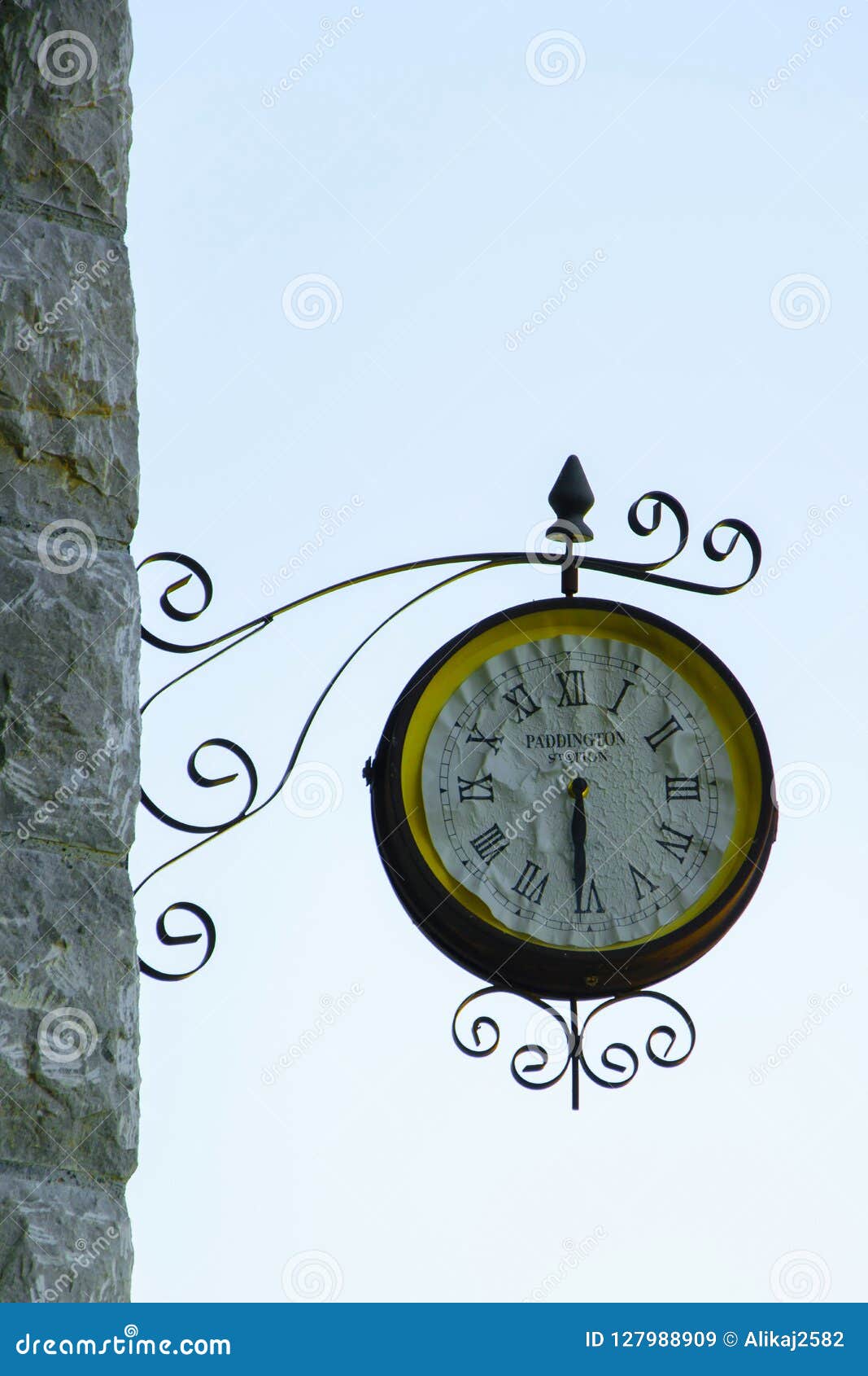 Old Fashioned Wall Clock with `Paddington Station` Text Inside Stock
