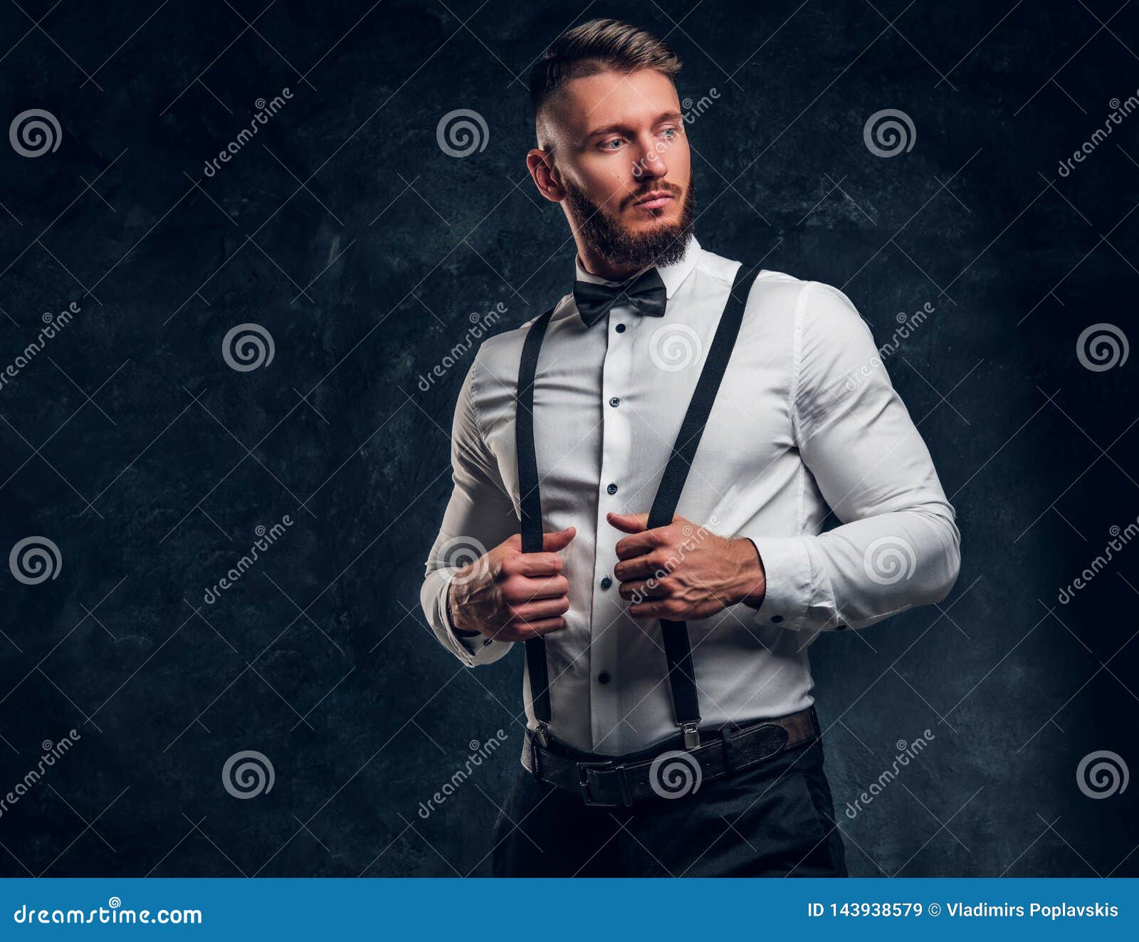 Stylishly Dressed Young Man In Shirt With Bow Tie And Suspenders ...