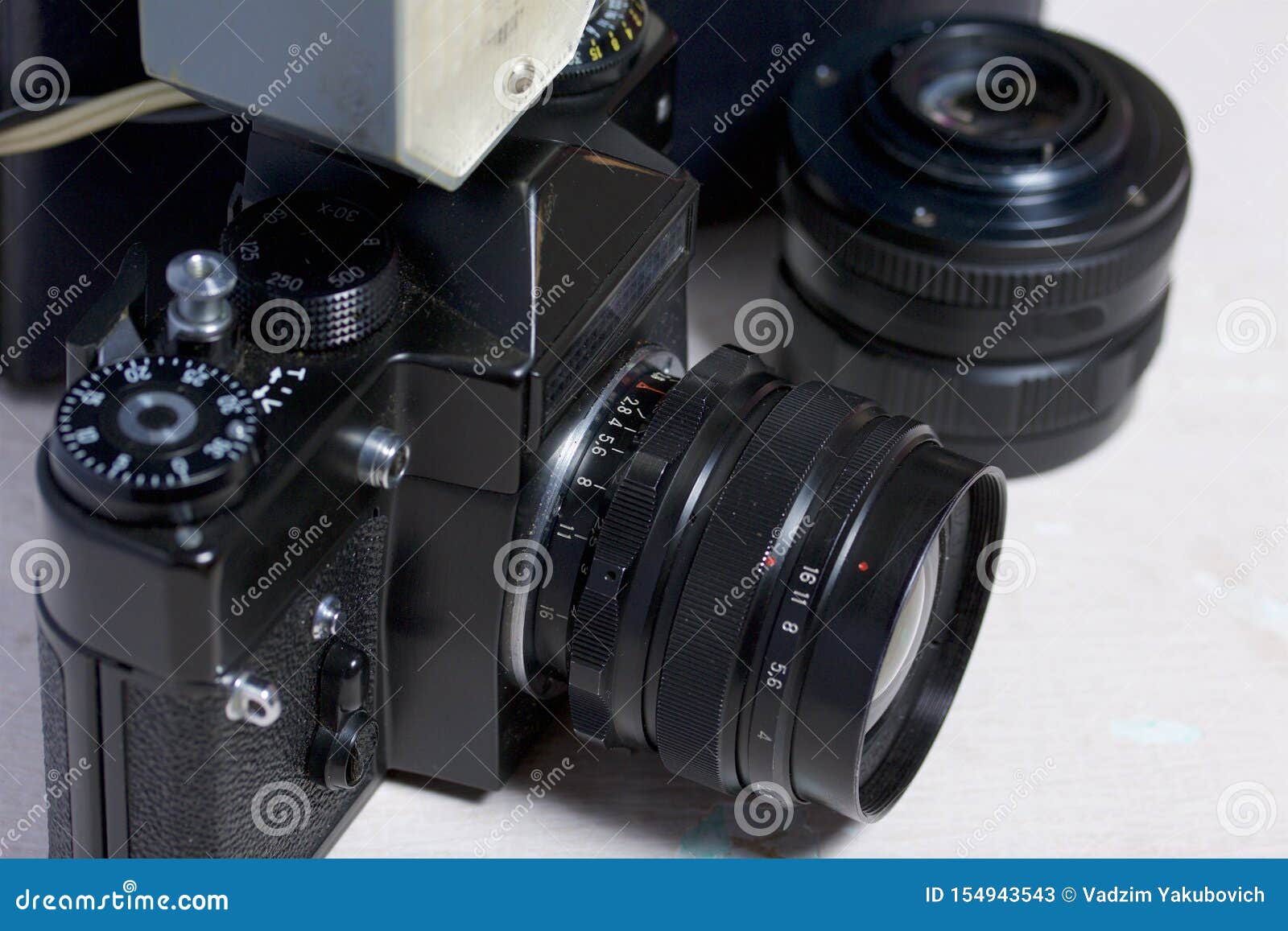 Old Film Camera, Removable Lens and Wired Flash. they Lie on the
