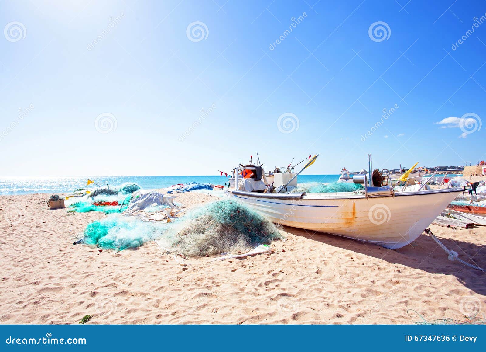 old fisher boat at the beach at armacao de pera in portugal