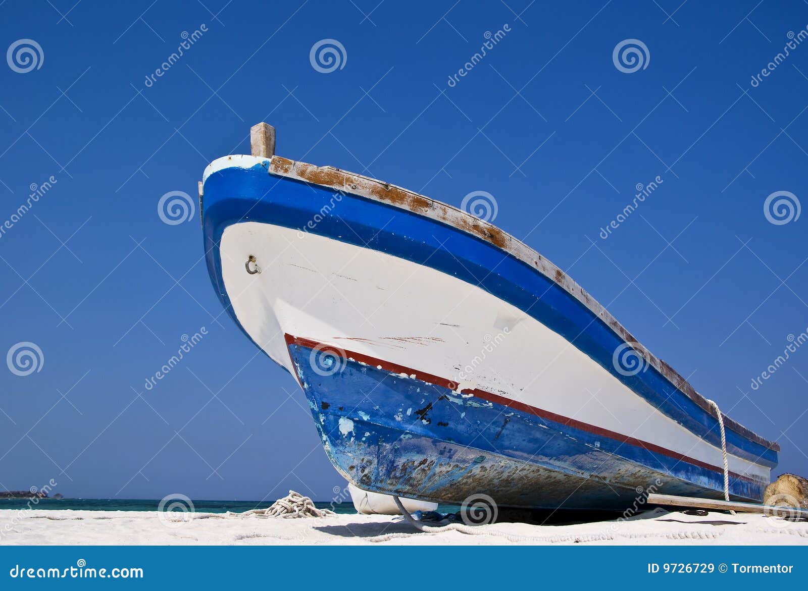 old fishing boat on a caribbean beach. stock image - image