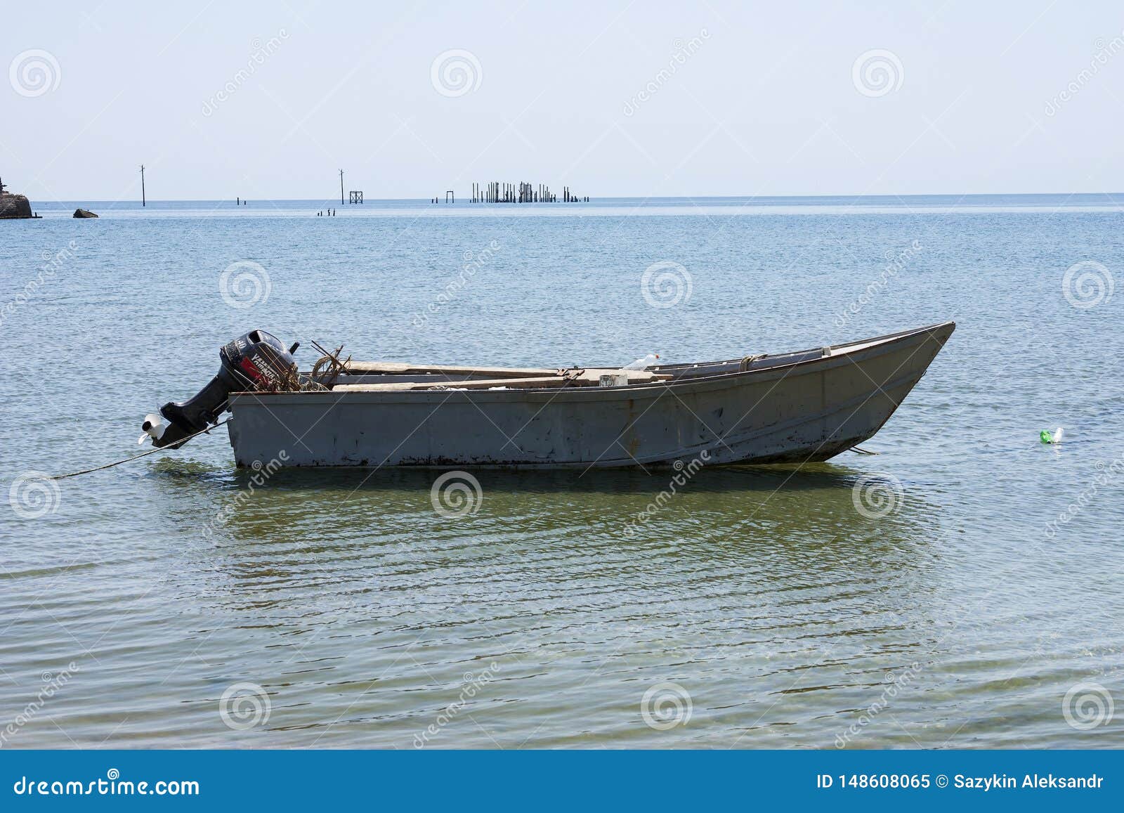 Old Fishing Boat with Motor on the Coast and in the Sea Water in Summer.  Stock Image - Image of nature, russia: 148608065