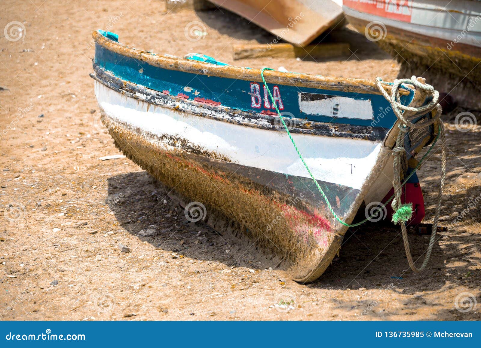 Old Fishing Boat on the Shore. Boat with Nets Waiting for