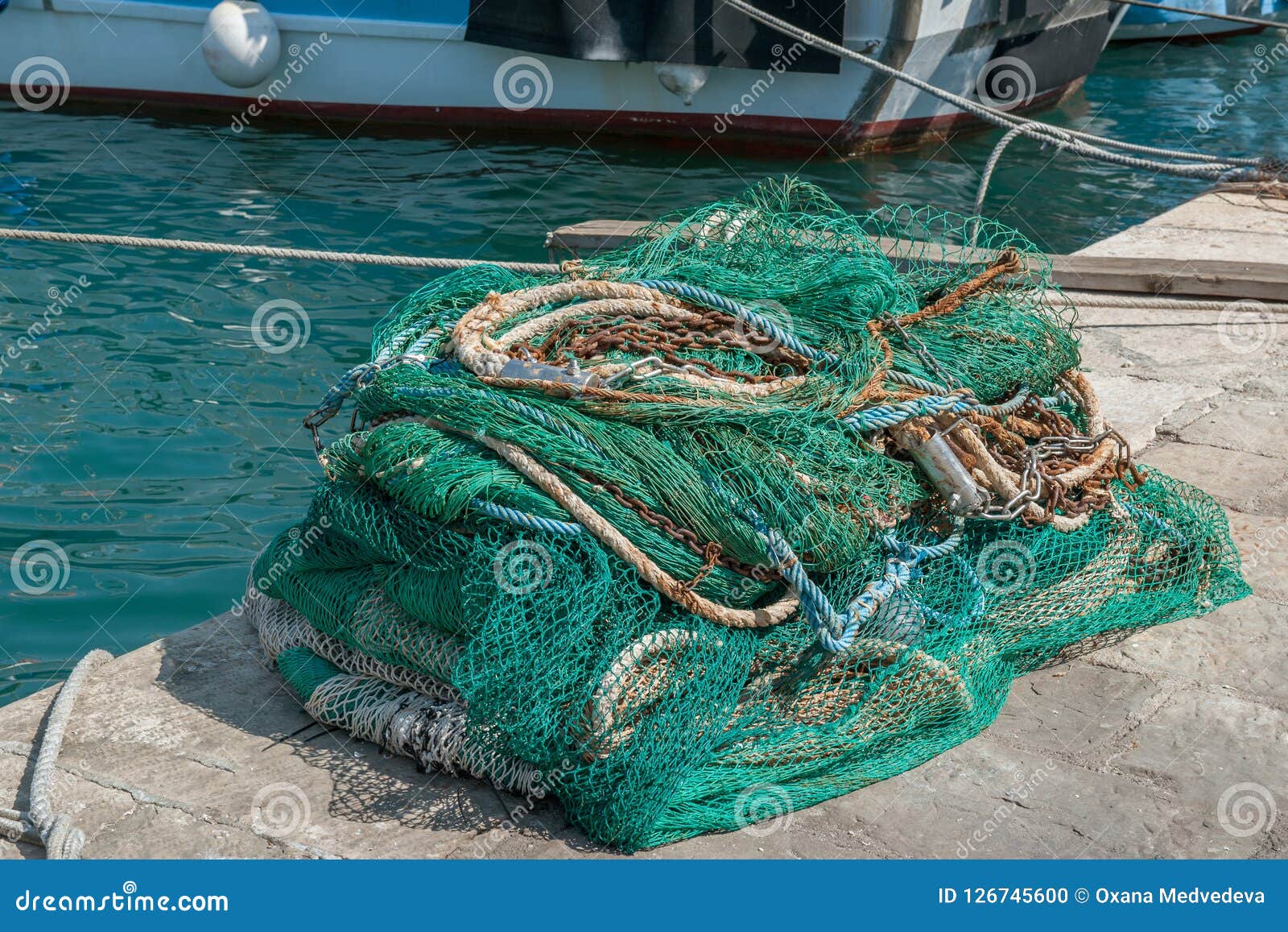 Old Fishing Nets are Dried on the Pier by the Sea. Fishing Stock